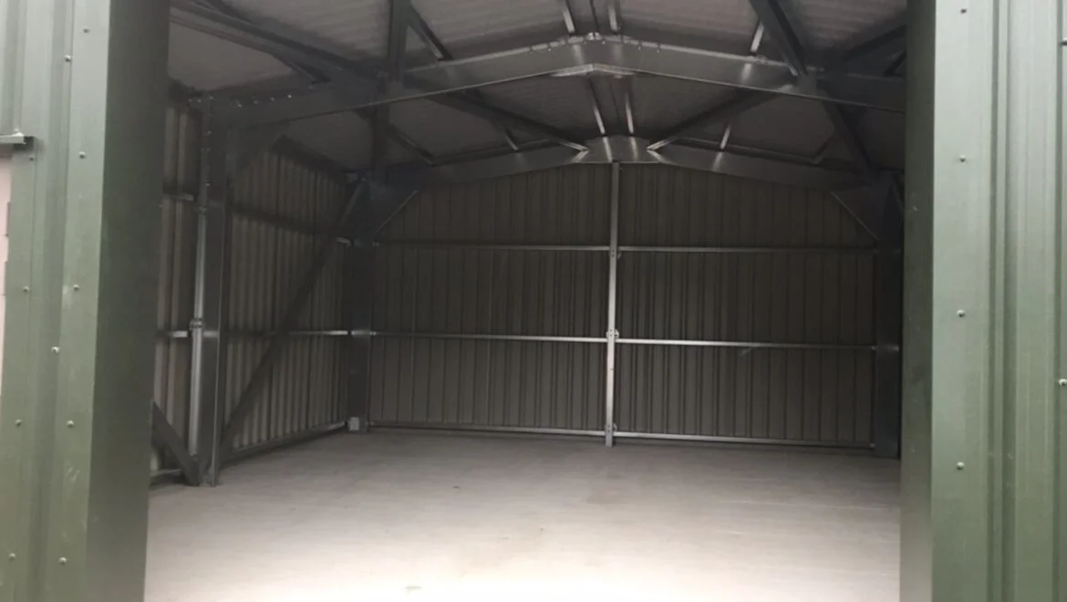 The inside of a khaki cold rolled steel building.