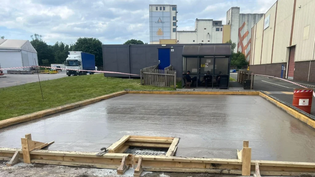 The foundation of a prefabricated steel building after groundworks have been conducted.