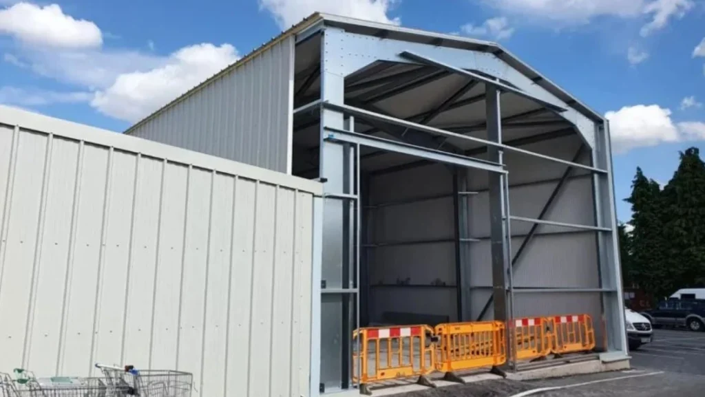 A large steel extension expands an existing facility.