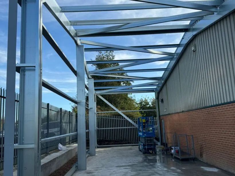 Cold rolled steel building frame with scissor lift.