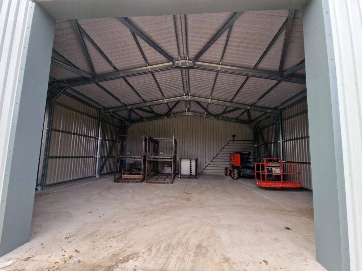 Internal shot of cold rolled steel frame with a scissor lift inside
