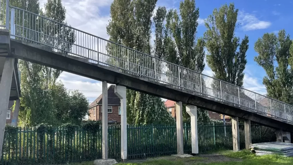 Concrete piers and railings of the Harrow Street footbridge