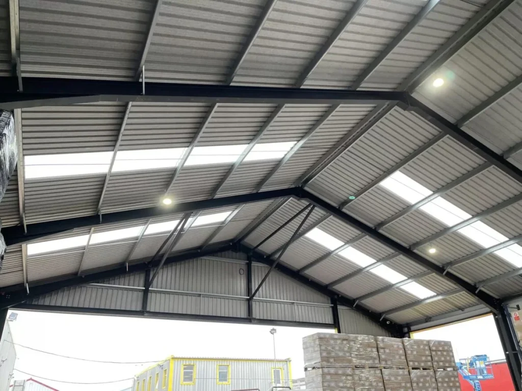 Internal view of the Mixed Freight Services steel building roof with rooflights and black portal frame