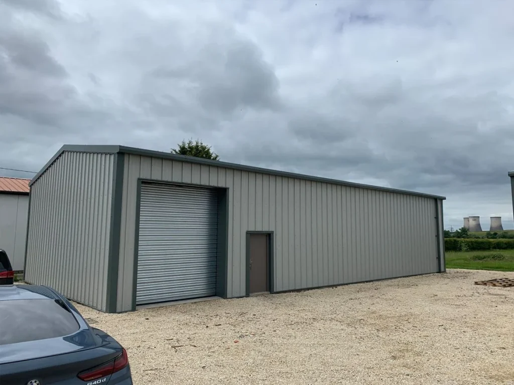Exterior of the Oxford Leathercraft steel building with roller shutter door and personnel door