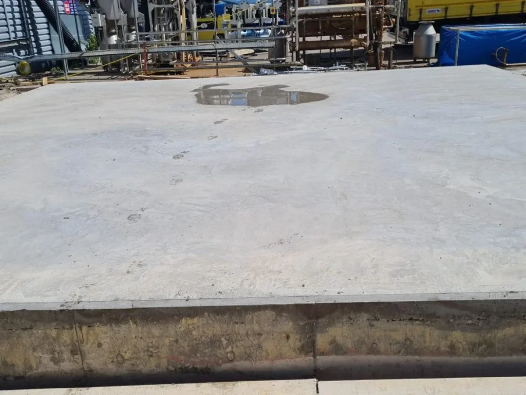 Completed reinforced concrete silo plinth cast alongside the process plant