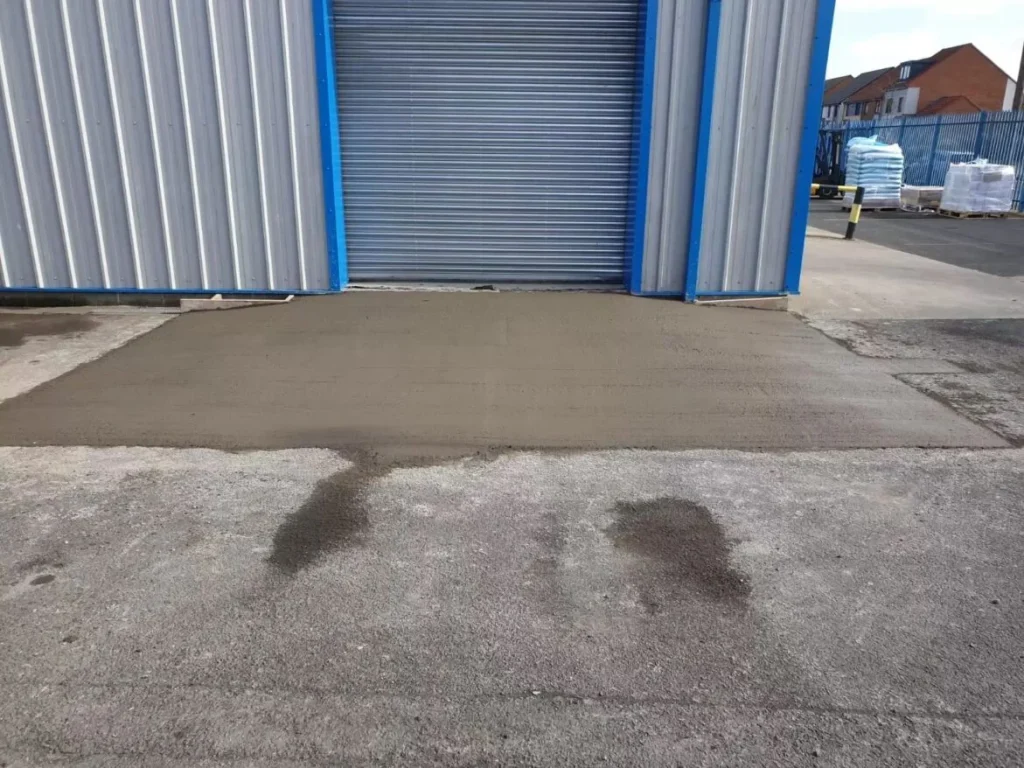 New concrete access ramp formed up to the roller shutter door at Simply Food Solutions Ltd