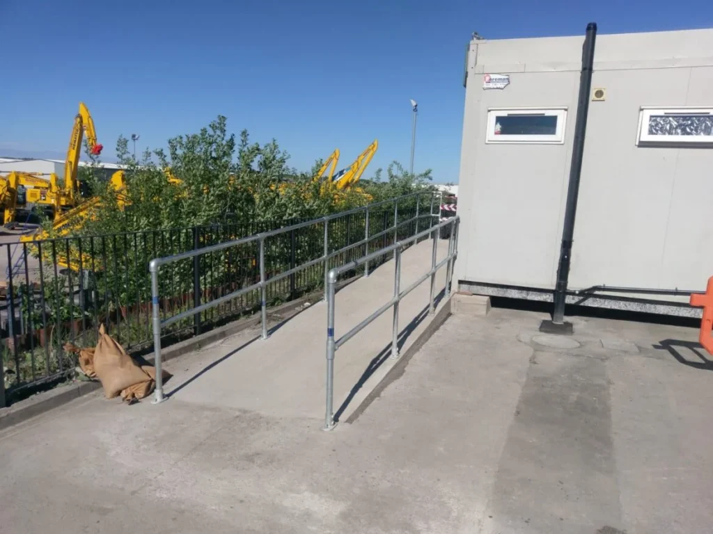 Steel handrail access ramp installed by Hamilton Steel leading to a site office