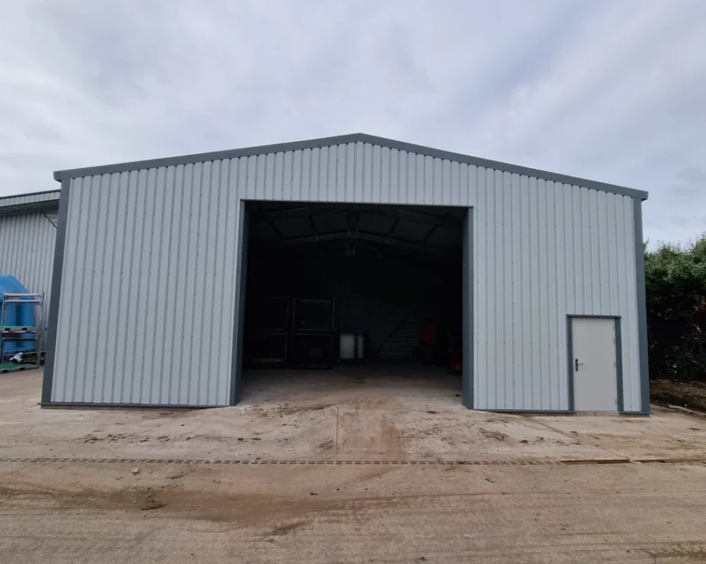 30m x 9m x 3m steel building special offer example with large open bay entrance