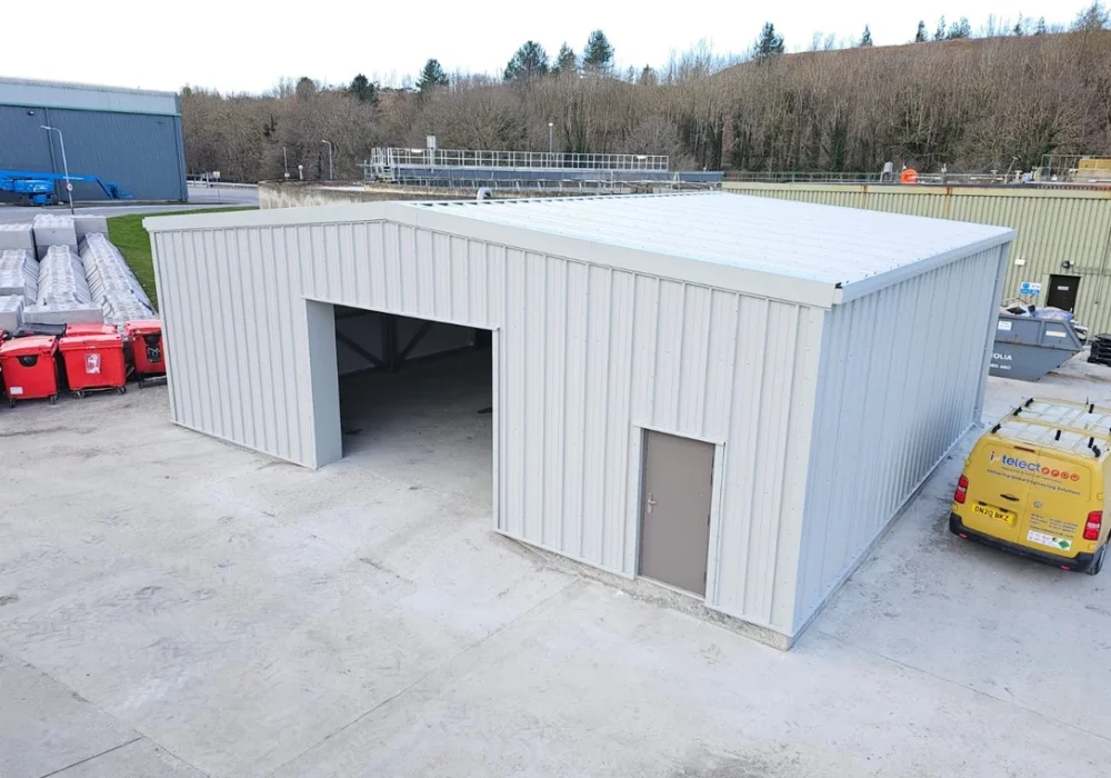 A 6m by 6m steel building kit with a 3m eave height, constructed with secure metal profile cladding for a workshop or double garage.