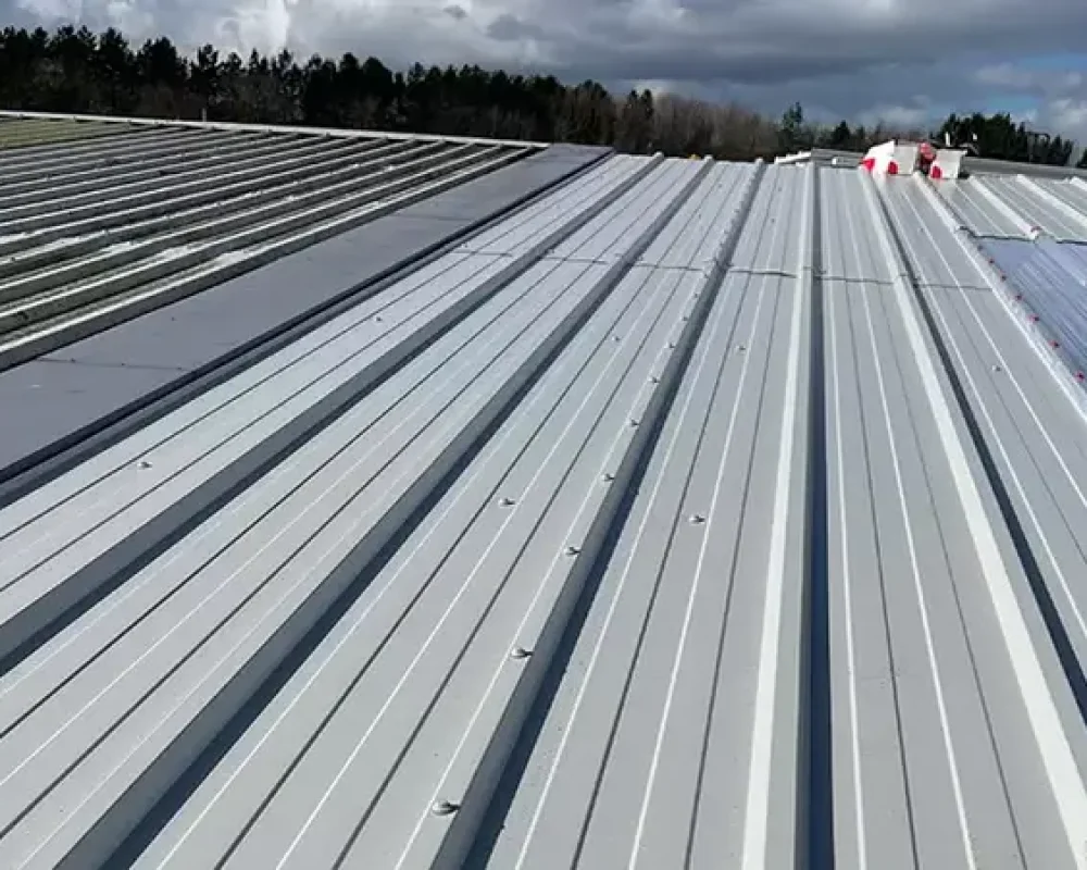 Close-up of grey cladding bedding installed on steel framed building
