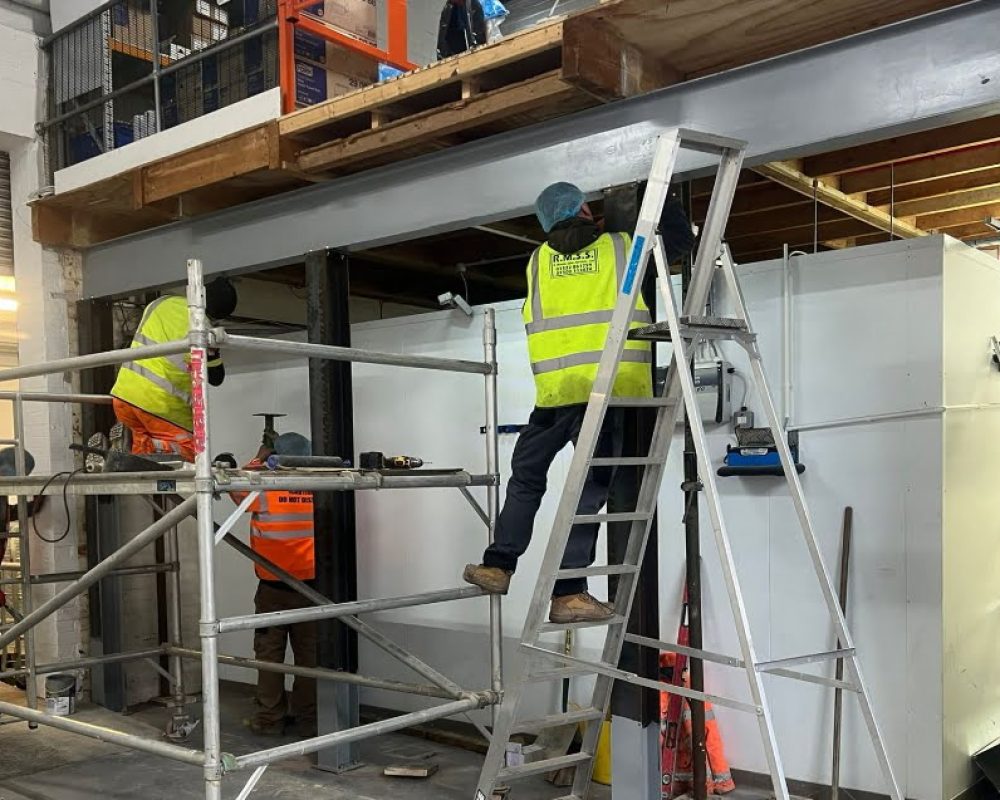 Hamilton Steel team installing a structural steel beam