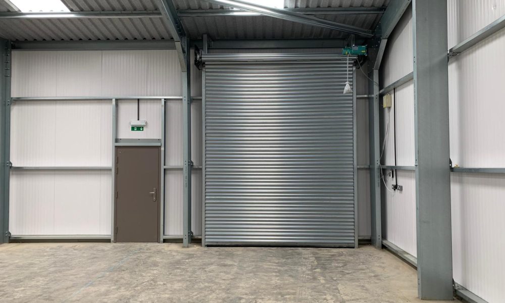Steel roller shutter door installed inside a Hamilton Steel warehouse building