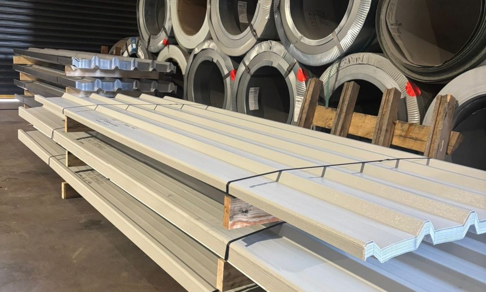 Galvanised steel coils and profiled roofing sheets stored in the Hamilton Steel warehouse